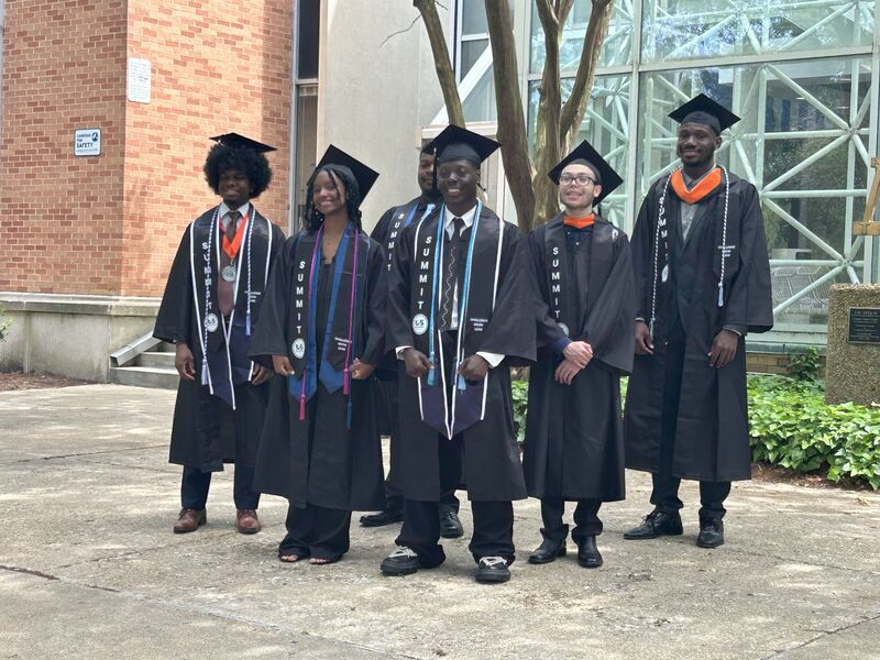 SUMMIT graduates celebrating on campus at 2025 graduation