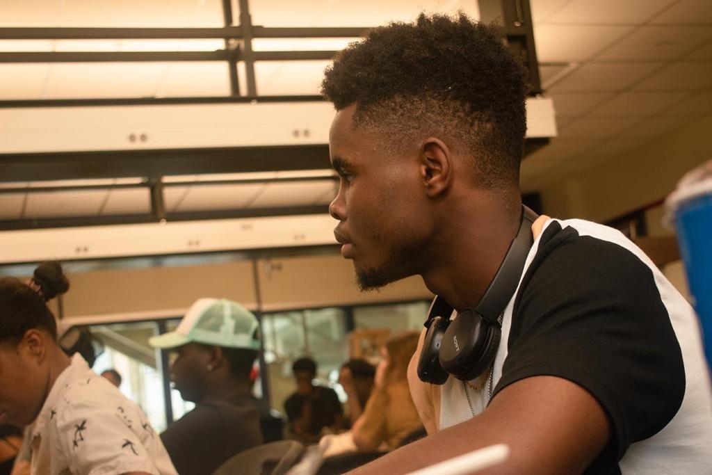 SUMMIT member focused during a session on campus