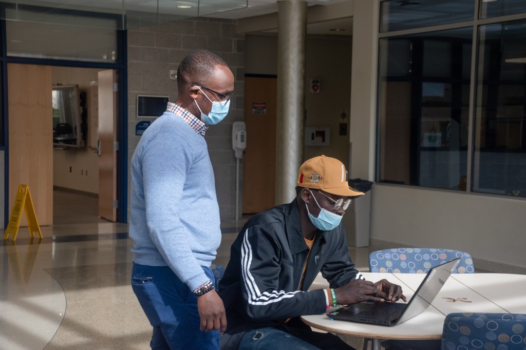 SUMMIT mentor guiding a student during a professional development session